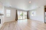 Step into this bright and airy living space, featuring gleaming hardwood floors and abundant natural light.