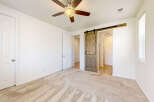 Step into this inviting bedroom featuring a rustic barn door leading to an ensuite bathroom.