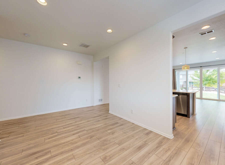 Experience modern living in this spacious home featuring an open-concept layout with gleaming hardwood floors.