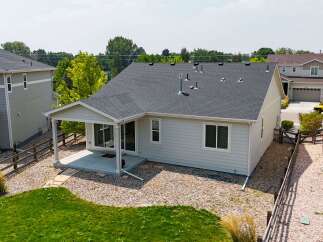 Discover this charming home featuring a covered patio perfect for outdoor relaxation and entertaining.