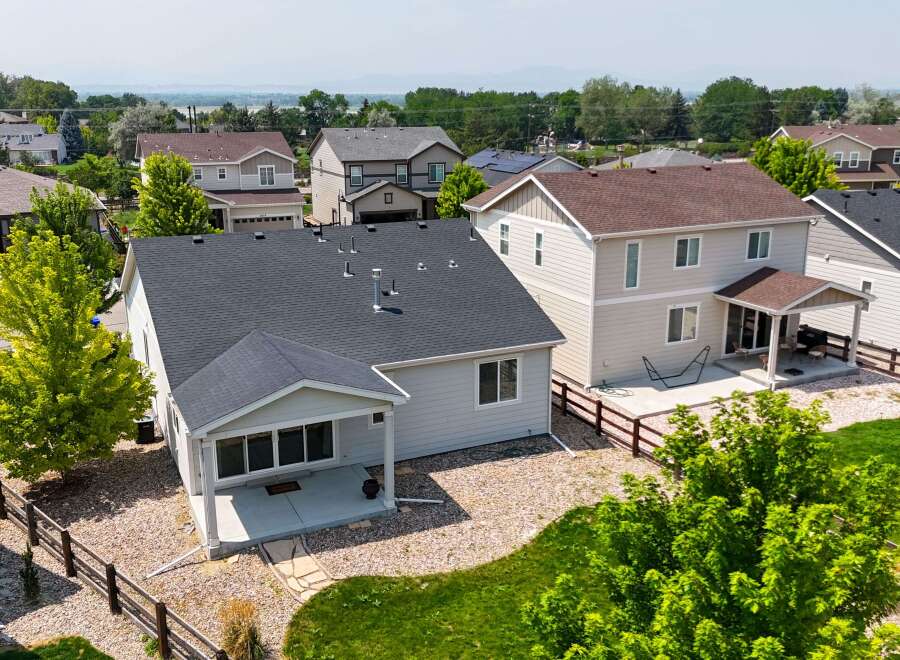 Discover this charming home featuring a spacious backyard with a covered patio, perfect for outdoor entertaining.