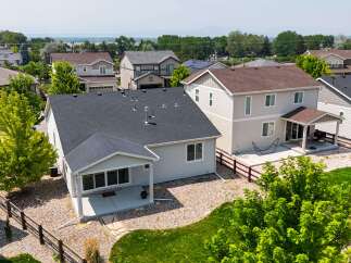 Discover this charming home featuring a spacious backyard with a covered patio, perfect for outdoor entertaining.