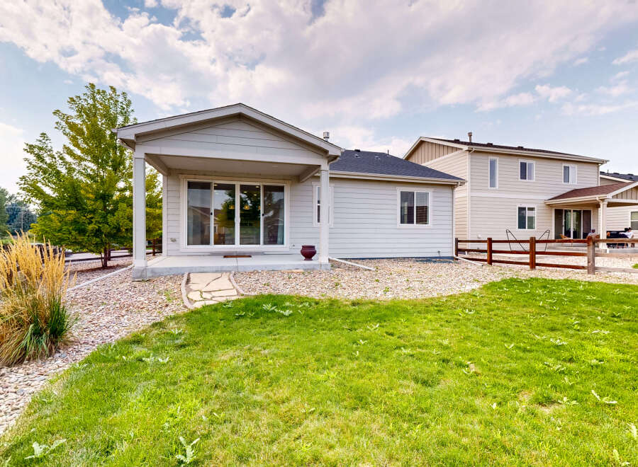 Enjoy outdoor living with this charming home featuring a covered patio perfect for entertaining.