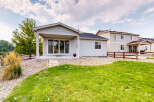 Enjoy outdoor living with this charming home featuring a covered patio perfect for entertaining.