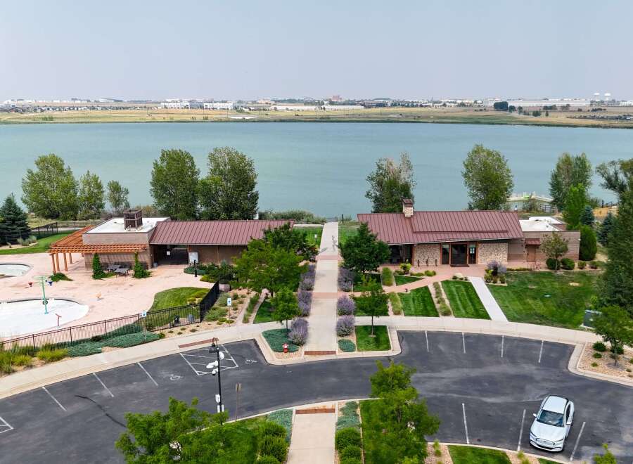 Discover modern living with this stunning property featuring a refreshing splash pad and a community pool, perfect for family fun.