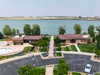 Discover modern living with this stunning property featuring a refreshing splash pad and a community pool, perfect for family fun.
