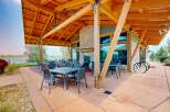 Enjoy outdoor dining and relaxation on this spacious patio, complete with comfortable seating and a stunning lake view.