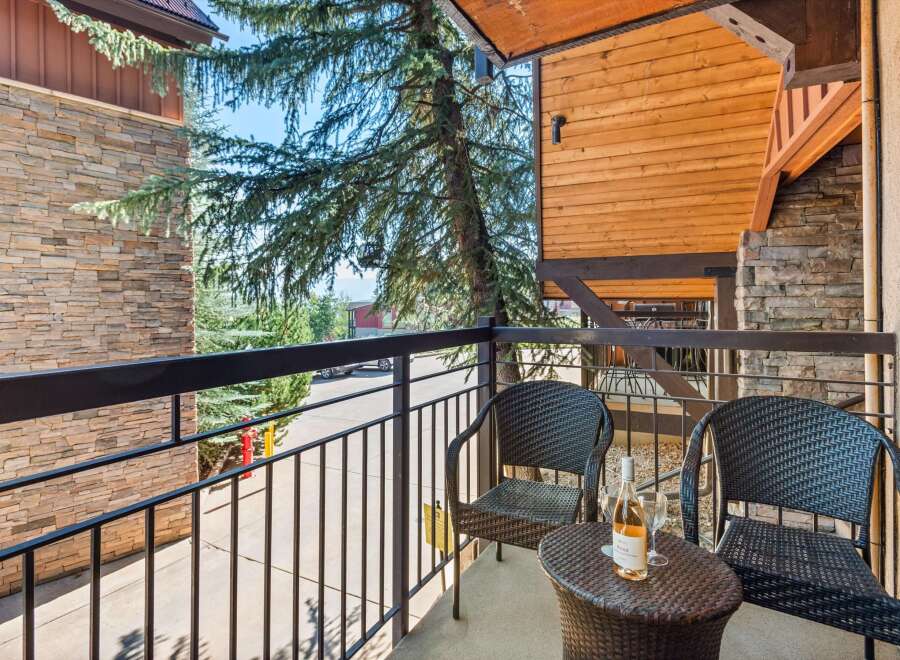 Enjoy your morning coffee or evening wine on this charming balcony, complete with two comfortable wicker chairs and a small table.