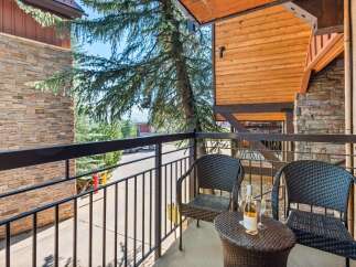 Enjoy your morning coffee or evening wine on this charming balcony, complete with two comfortable wicker chairs and a small table.