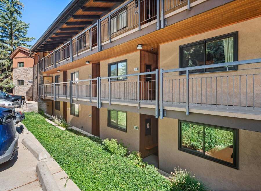 Discover comfortable living in this multi-story apartment building featuring exterior walkways and balconies.