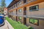 Discover comfortable living in this multi-story apartment building featuring exterior walkways and balconies.