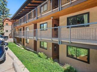 Discover comfortable living in this multi-story apartment building featuring exterior walkways and balconies.