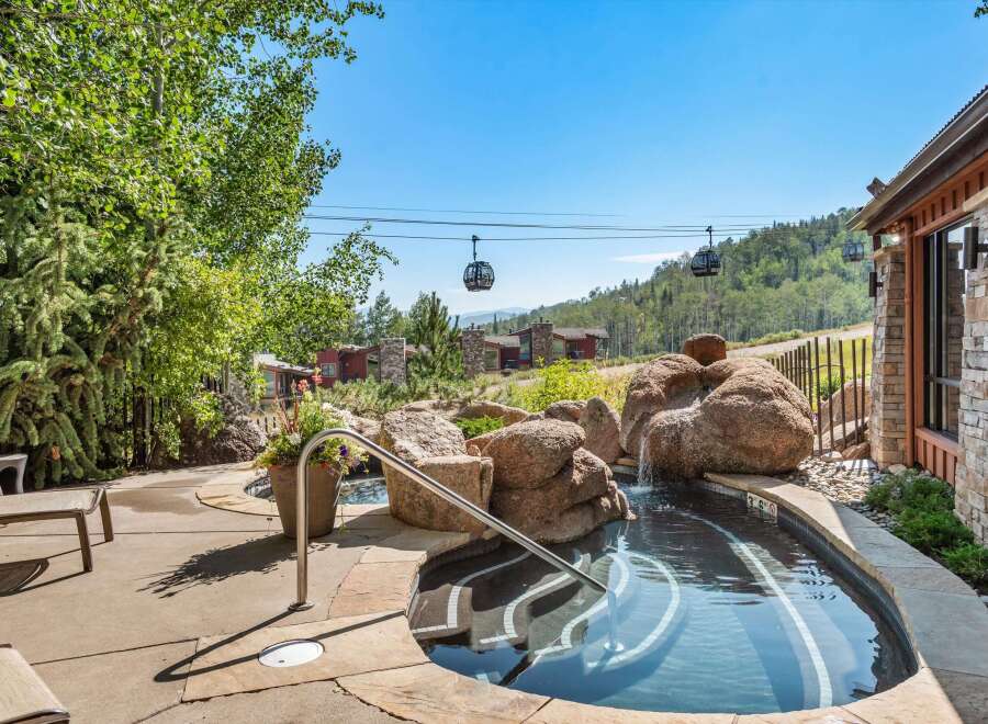 Experience luxury mountain living with this stunning property featuring a private hot tub and breathtaking views.