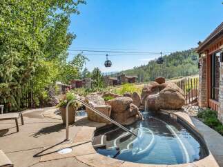 Experience luxury mountain living with this stunning property featuring a private hot tub and breathtaking views.