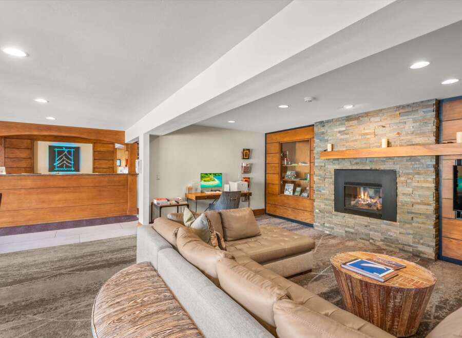 Experience comfort and style in this inviting living space, featuring a plush sectional sofa perfect for relaxation.