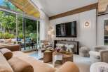 Experience modern living in this stunning living room, featuring a large sectional sofa and a sleek entertainment center.