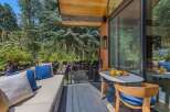 Enjoy your morning coffee on this charming patio, complete with a comfortable outdoor seating area and a dining set perfect for al fresco meals.