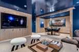 Experience modern luxury in this stunning living space featuring a high-gloss navy ceiling that adds a dramatic flair.
