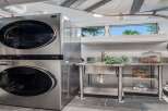 Discover modern convenience in this laundry room, featuring a sleek LG stackable washer and dryer set.