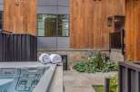 Experience ultimate relaxation with this luxurious outdoor spa, complemented by plush rolled towels for your comfort.