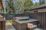 Experience ultimate relaxation in this backyard oasis, featuring a luxurious hot tub perfect for unwinding after a long day.
