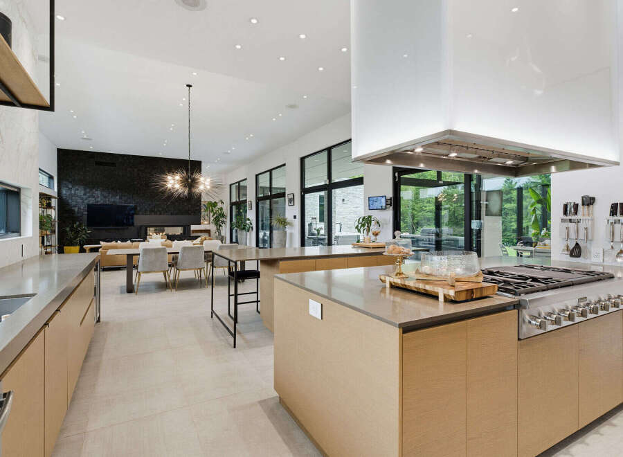 Experience luxury living in this expansive open-concept kitchen and dining area, perfect for entertaining.