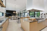 Experience luxury living in this expansive open-concept kitchen and dining area, perfect for entertaining.