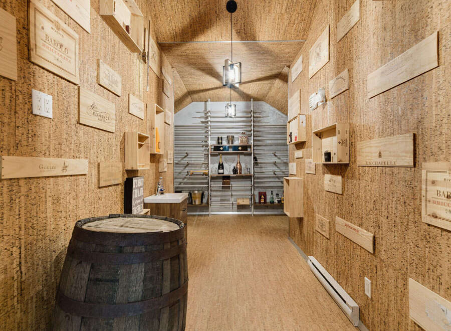 Discover this exquisite wine cellar, featuring a unique cork-lined ambiance that enhances the tasting experience.