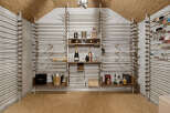 Discover this exquisite wine cellar, featuring a sophisticated racking system designed to elegantly display your collection.