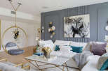 Experience modern luxury in this stunning living room, featuring a unique hanging chair and a captivating abstract horse painting.