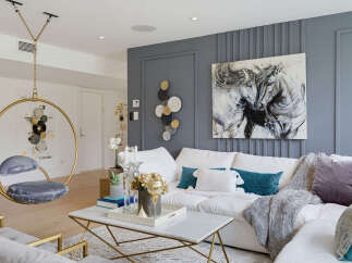 Experience modern luxury in this stunning living room, featuring a unique hanging chair and a captivating abstract horse painting.