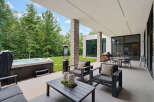 Experience ultimate relaxation and entertainment in this luxurious outdoor living space, featuring a spacious hot tub perfect for unwinding.