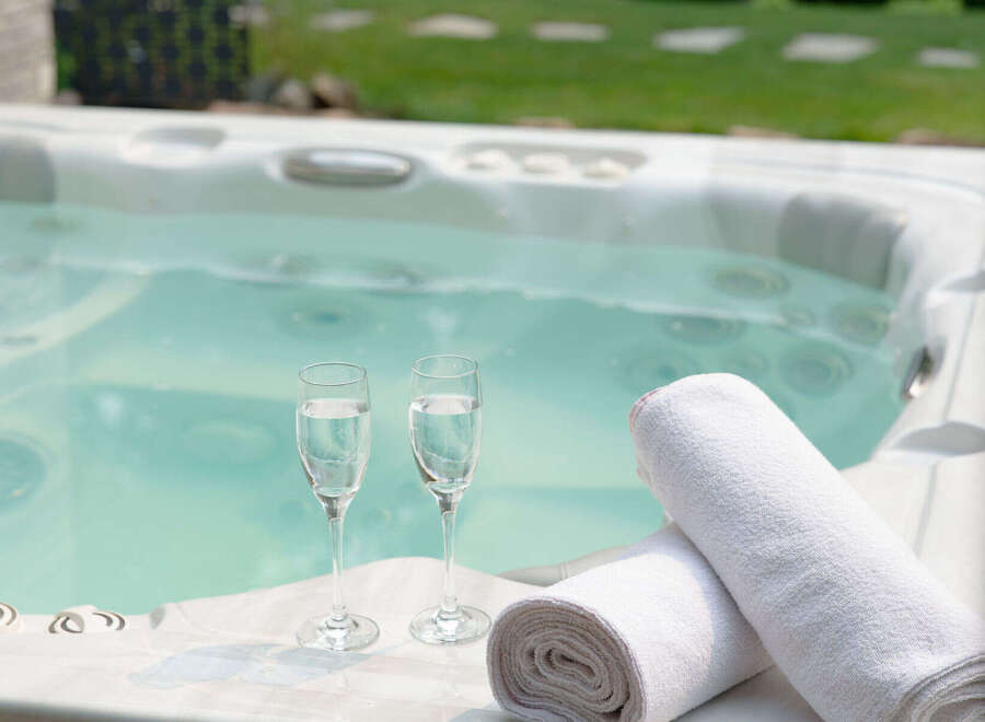 Indulge in ultimate relaxation with this luxurious hot tub, perfect for unwinding after a long day.