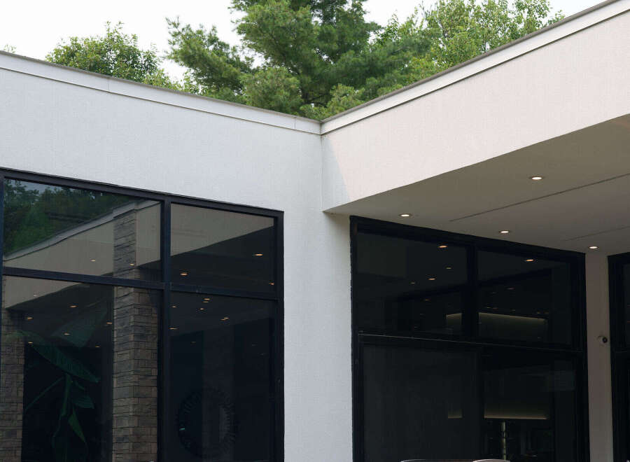 Experience modern luxury with expansive floor-to-ceiling windows that flood the space with natural light.