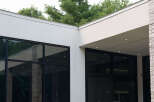Experience modern luxury with expansive floor-to-ceiling windows that flood the space with natural light.
