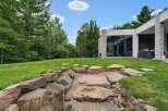 Experience modern luxury in this stunning home featuring a sleek architectural design and expansive windows that seamlessly blend indoor and outdoor living.