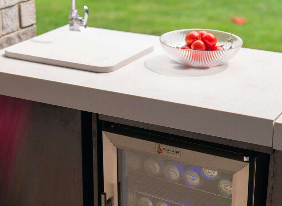 Experience outdoor living at its finest with this stylish outdoor kitchen setup.