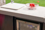 Experience outdoor living at its finest with this stylish outdoor kitchen setup.