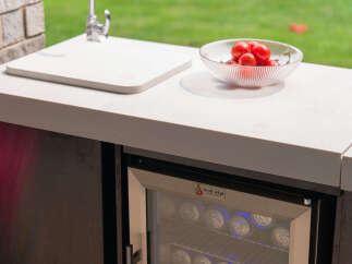 Experience outdoor living at its finest with this stylish outdoor kitchen setup.