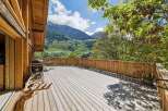 Enjoy breathtaking mountain views from this expansive wooden deck, perfect for outdoor entertaining.