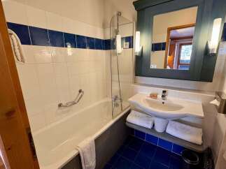 This charming bathroom features a clean and functional design, perfect for any home.