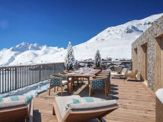 Experience luxury mountain living with this stunning property featuring a spacious outdoor deck perfect for entertaining.