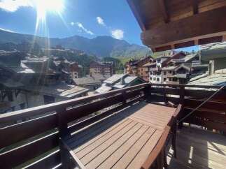 Enjoy breathtaking mountain views from this charming balcony, perfect for al fresco dining or morning coffee.