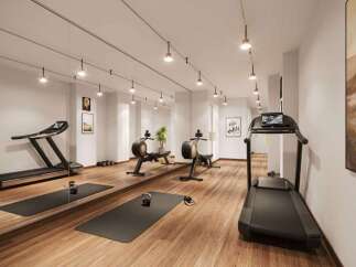 Elevate your fitness routine in this modern home gym, featuring a state-of-the-art treadmill and rowing machines.