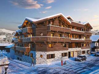 Experience luxury mountain living in this stunning chalet-style property, featuring a charming wooden exterior and stone accents, perfect for a winter getaway.