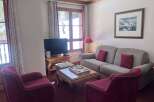Experience ultimate comfort in this inviting living room, featuring plush seating and a cozy ambiance.