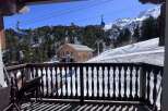 Experience breathtaking mountain views from this charming chalet, complete with a private balcony overlooking a ski resort.