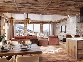 Experience luxurious mountain living in this stunning chalet-style apartment, featuring a spacious open-plan living area with a modern kitchen island and a cozy dining space.