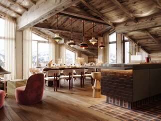 Experience luxury mountain living in this stunning chalet, featuring a grand dining area with a suspended fireplace and panoramic views.