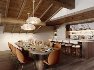 Experience luxurious mountain living in this stunning dining and bar area, featuring a grand wooden dining table set for a feast and a sleek, modern bar with marble accents.